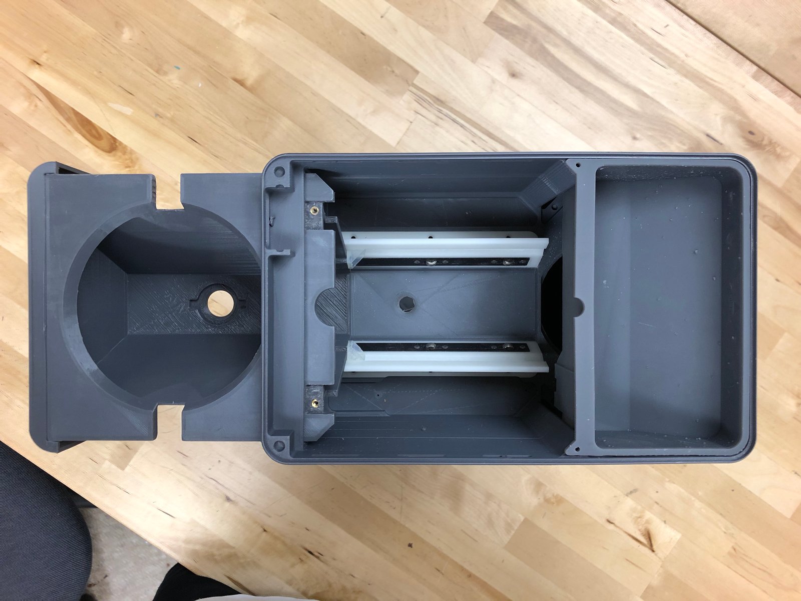  The rails are printed with Formlabs' Rigid resin, and use retention brackets (FDM Nylon 6) to keep the bearings in-placce. Wings printed with Duable resin engage the drawer to the rails, allowing it to slide effortlessly. 