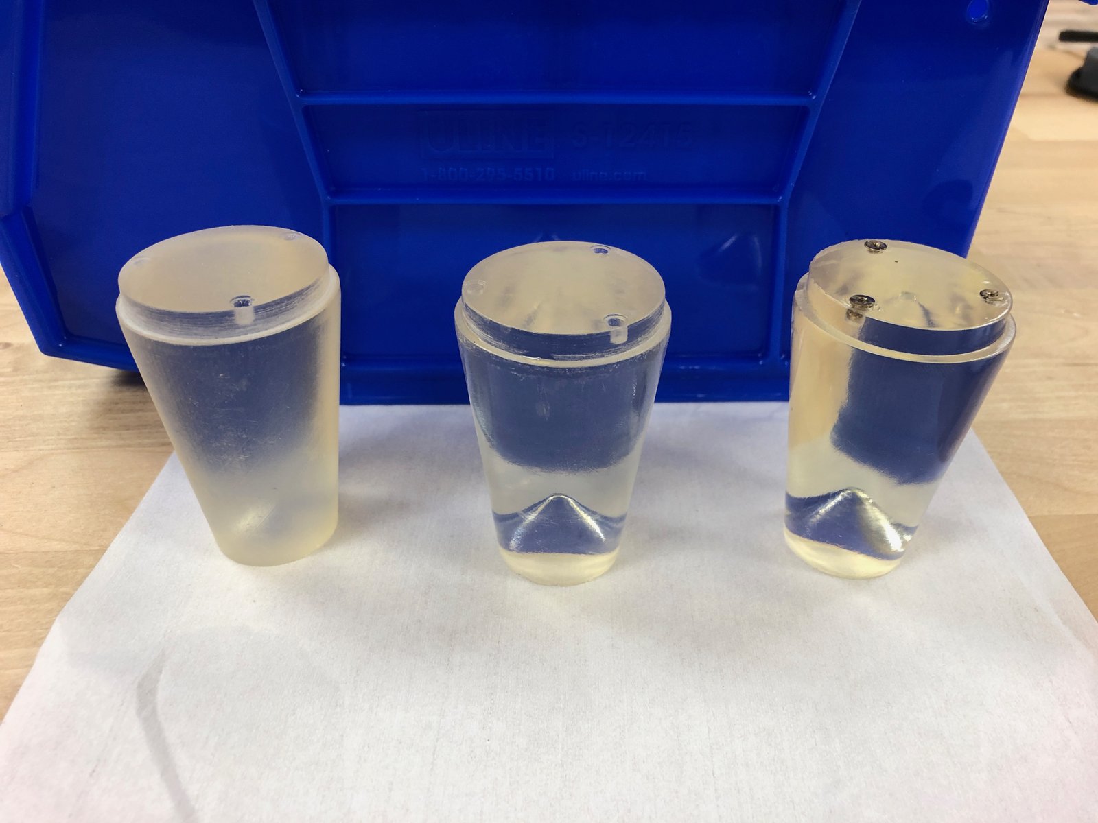  A series of conical lenses that explored refining the resin's surface. SLA 3D printing produces isotropic models, making Formlabs' Clear Resin ideal for uniformly transmitting light. When sufficiently polished, the outer surface produces a wide and bright cast akin to a transparent 75 watt incandescent bulb. (Left to right: only UV post-cure; no post-cure, buffed down to 12,000-grit; and no UV post-curing, buffed down to 12,000-grit, coated with high-gloss acrylic lacquer.) 